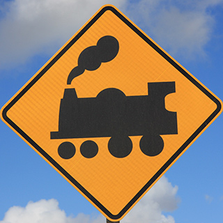 Image of a road sign with a train on it