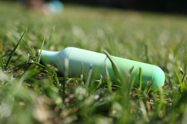 Disposable vape thrown away in grass
