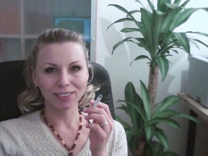 One of our customer poses with an electronic cigarette.